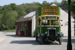 Amberley Museum old fashioned green and yellow double decker bus with open top