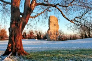 Bramber castle in the winter with snow on the grass