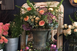 Antique urn filled with flowers at Cuckfield's independent shops