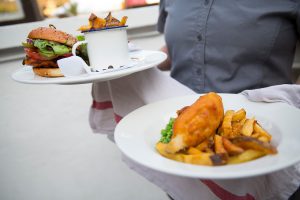 Burger and fish and chips on a plate