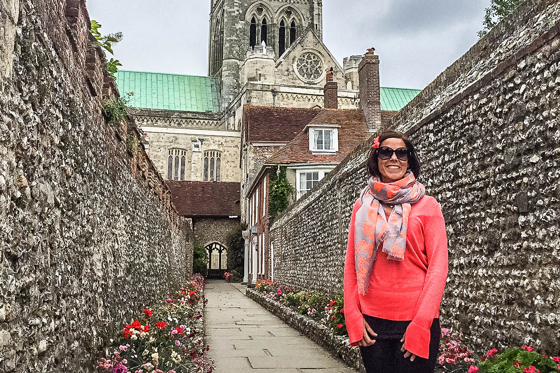 Woman posing by Chichester cathedral