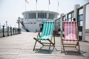 Two deck chairs on Worthing Pier