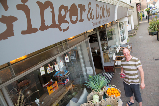 A customer in front of Ginger and Dobbs grocery store in Shoreham-by-Sea, West Sussex