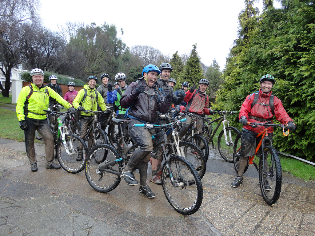 Muddy cyclists on a guided ride