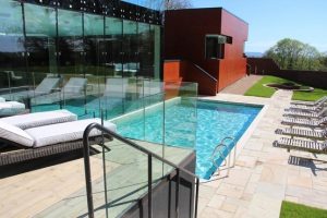 Ockenden Manor Spa outdoor pool and sun loungers