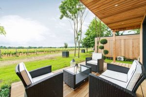 Tinwood lodges outdoor seating overlooking the vineyard