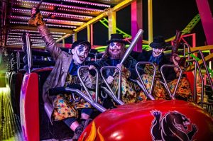 Three scary clowns on a rollercoaster ride at Tulleys Farm