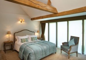 Halfway Bridge Inn guest bedroom with oak beams