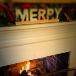 The Halfway Bridge fireplace with christmas sign on mantle