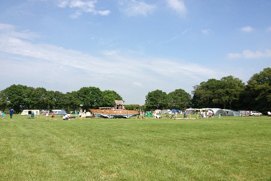 An green open field at Blacklands Farm campsite in Sussex