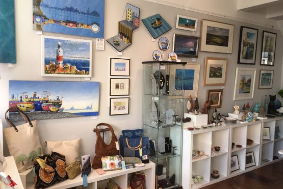 The interior of Shoreham Art Gallery showing pictures, crafts and objects