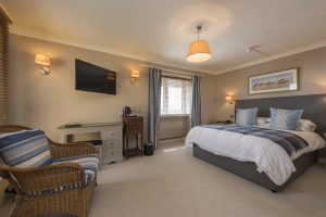A guest bedroom at The Beachcroft Hotel