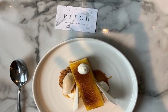 A culinary dessert presented on a white plate from Pitch restaurant in Worthing