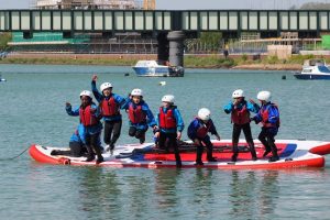 A group of children jumping into the water at the Adur Centre in Sussex