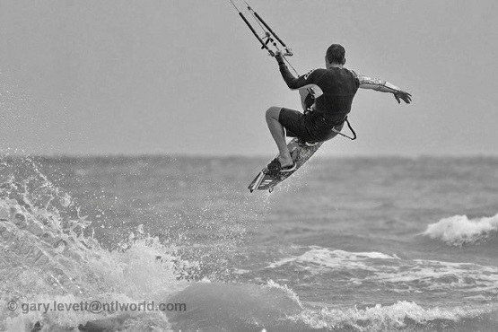 Black and white image of a kite boarder on the sea in West Sussex