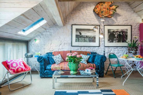 Colourful sofa and living area in The Doghouse accommodation in Pulborough, West Sussex