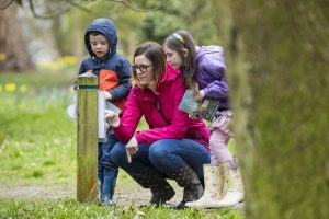 Visitors on an Easter egg hunt at Winkworth Arboretum