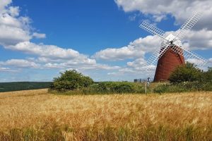 West Sussex Windmill in a field with blue skies
