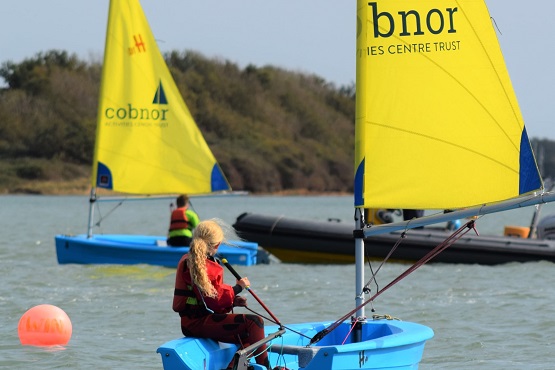 Young girl on a boat during a Cobnor Activity Centre Trust class