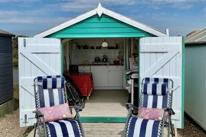 Sussex Beach Hut with two sun loungers in front