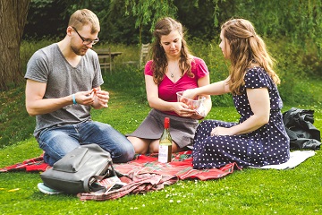 Friends having a picnic in West Dean Gardens, West Sussex