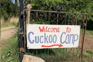 A gate with cuckoo camp on